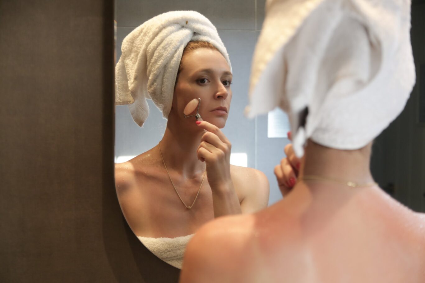 Woman Using Rose Quartz Face Roller